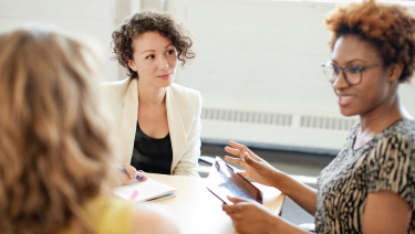 Woman leading casual meeting