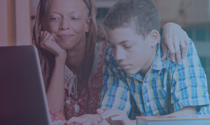 Woman and child at computer